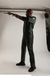 ERIC STANDING POSE WITH GUNS